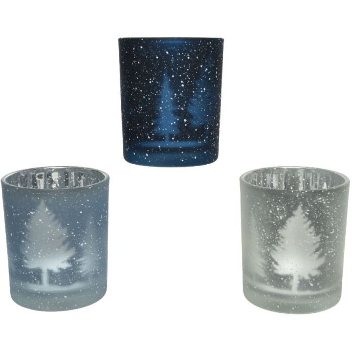 Frosted glass candle holders with snowy trees, in shades of blue and white.