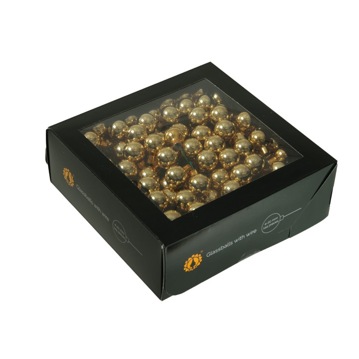 Boîte carrée en noir, contenant de nombreuses billes dorées scintillantes.