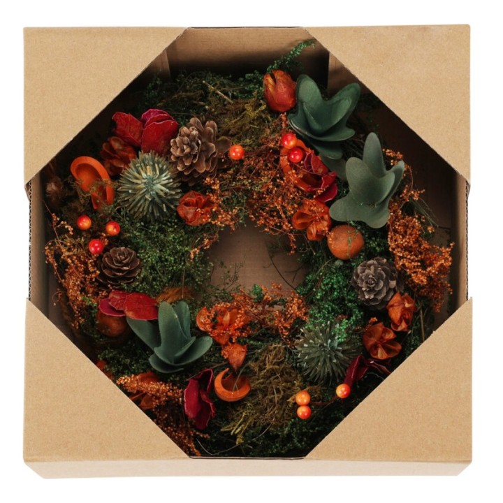 A rustic wreath of greens, pinecones, and vibrant dried flowers in a simple box.