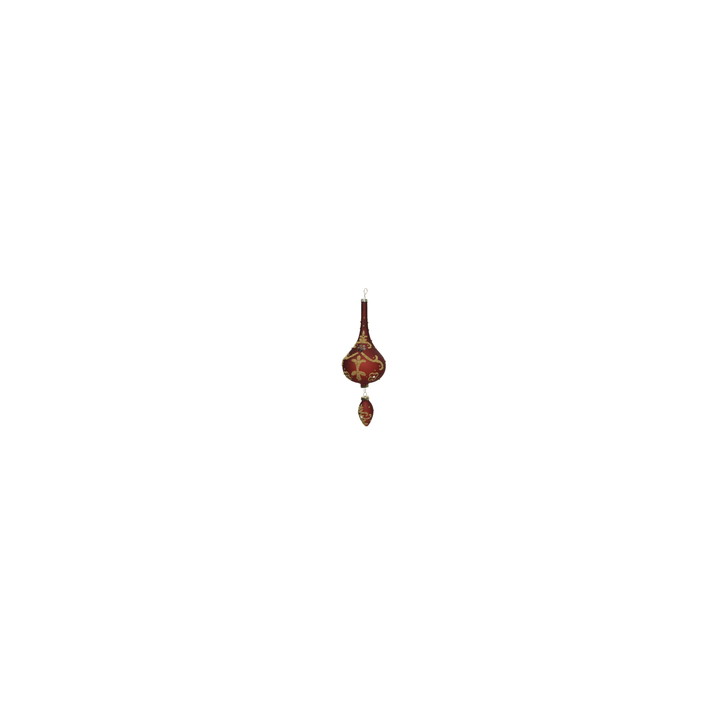 A decorative, elongated ornament in rich red with gold intricate designs and a pointed bottom.