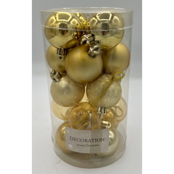 A clear container filled with various gold and champagne-colored decorative baubles.