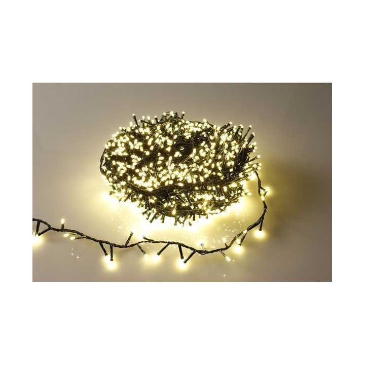 A tangled bundle of warm white fairy lights on a light background.