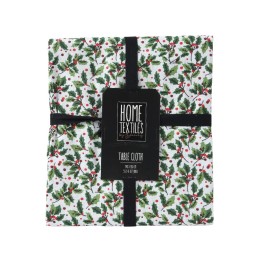 A folded tablecloth with a white background adorned with green leaves and red berries.