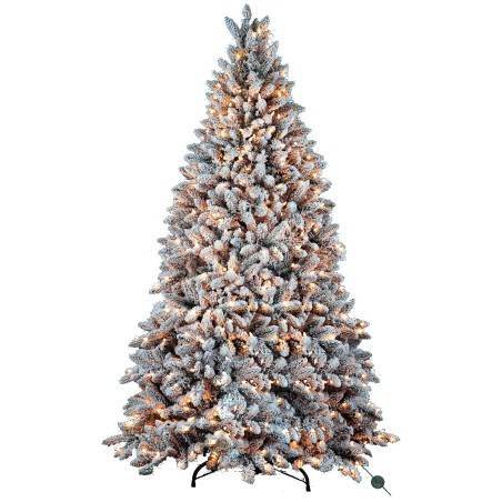 A frosted artificial Christmas tree, lush and layered, adorned with warm glowing lights.