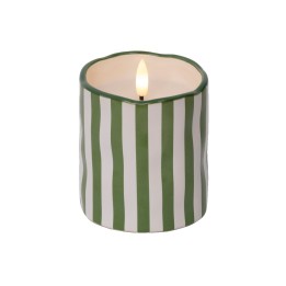 A green and white striped candle with a flickering flame atop a wavy edge.