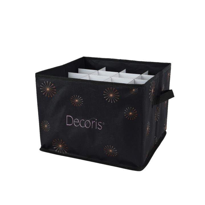 A black storage bin with gold starburst patterns and a fabric handle.