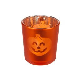 An orange glass candle holder with a smiling jack-o'-lantern design.
