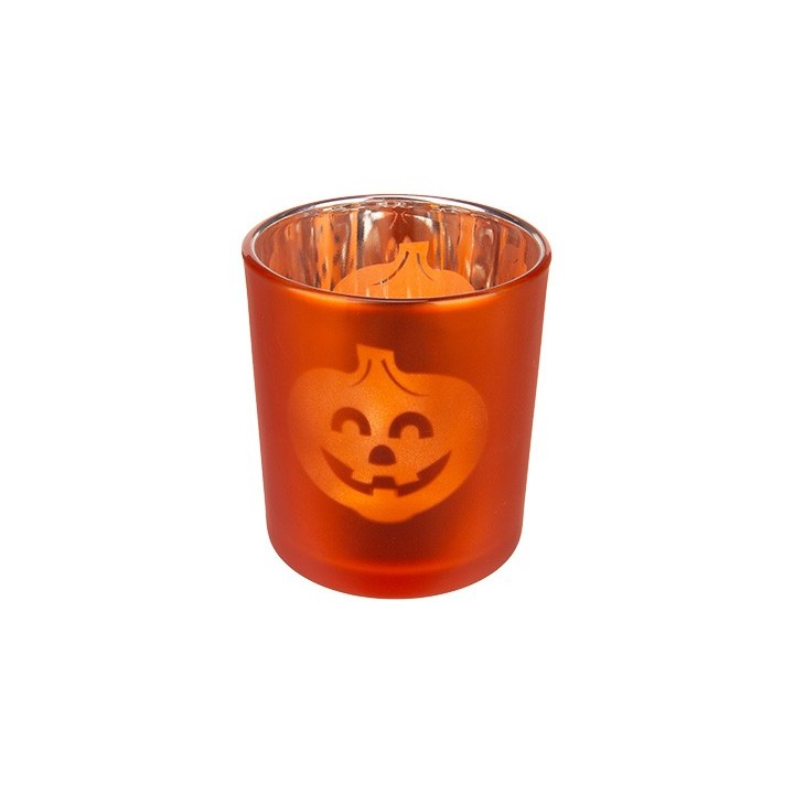 An orange glass candle holder with a smiling jack-o'-lantern design.