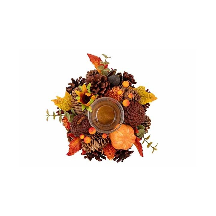 A circular arrangement of autumn leaves, pine cones, and a small glass candle.