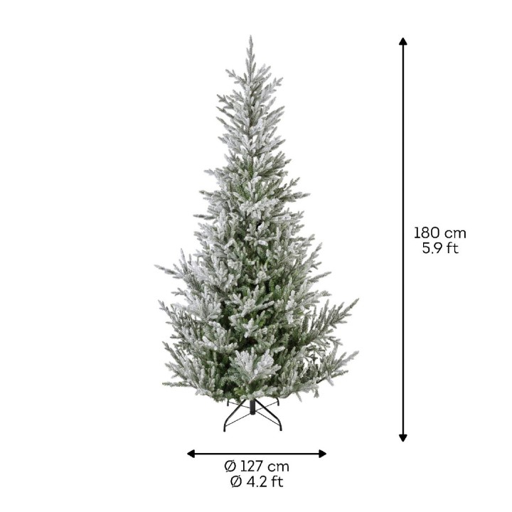 A tall, frosted Christmas tree with realistic branches on a sturdy black stand.