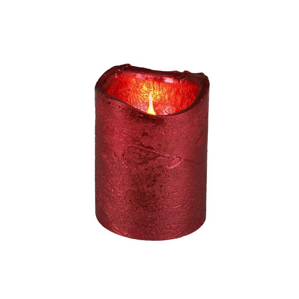 Bougie rouge, texture rustique, lumière chaleureuse émanant d'un sommet irrégulier.