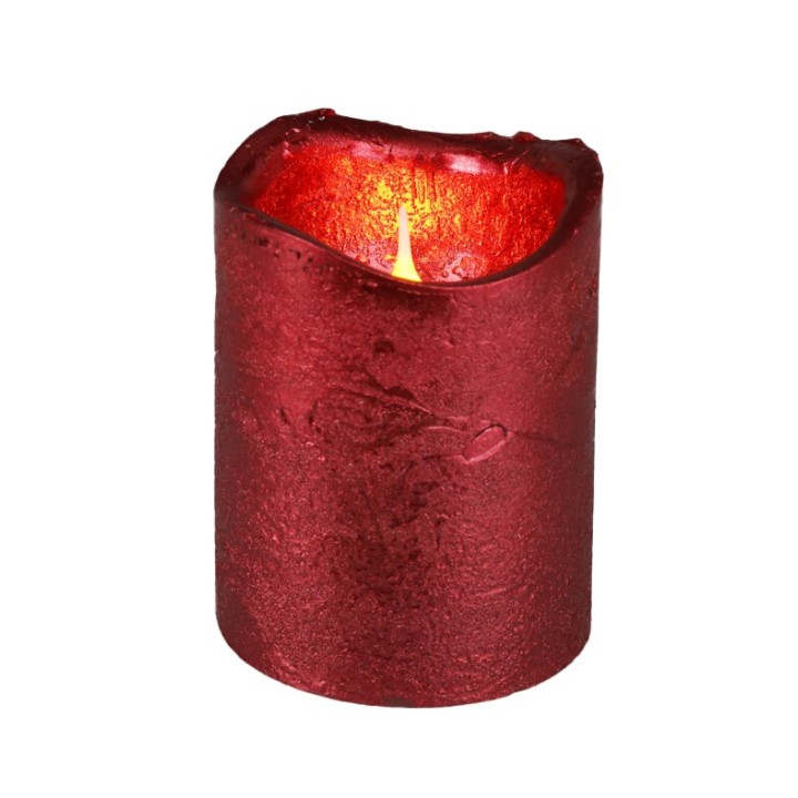 A deep red, textured candle with a flickering light at the top.