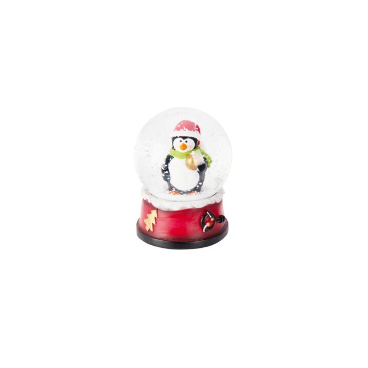 A cheerful penguin in a red hat and green scarf inside a festive snow globe.