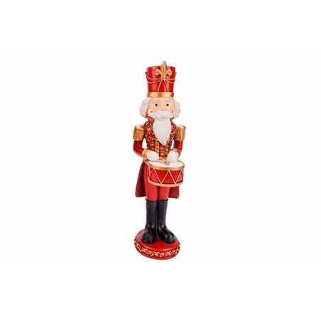 Kleurrijke kerstfiguur van een trommelende nutcracker in rood, goud en zwart. Kleurrijke kerstfiguur van een trommelende nutcracker in rood, goud en zwart.