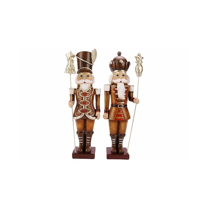 Two wooden nutcracker figures in festive attire, one with a tall hat and the other a crown.