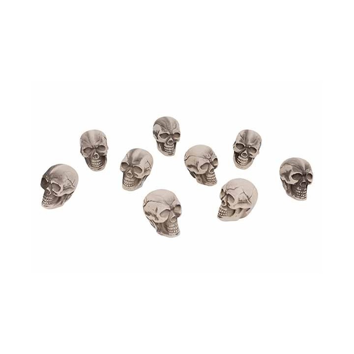 A collection of small, gray skulls with detailed features arranged in a scattered pattern.