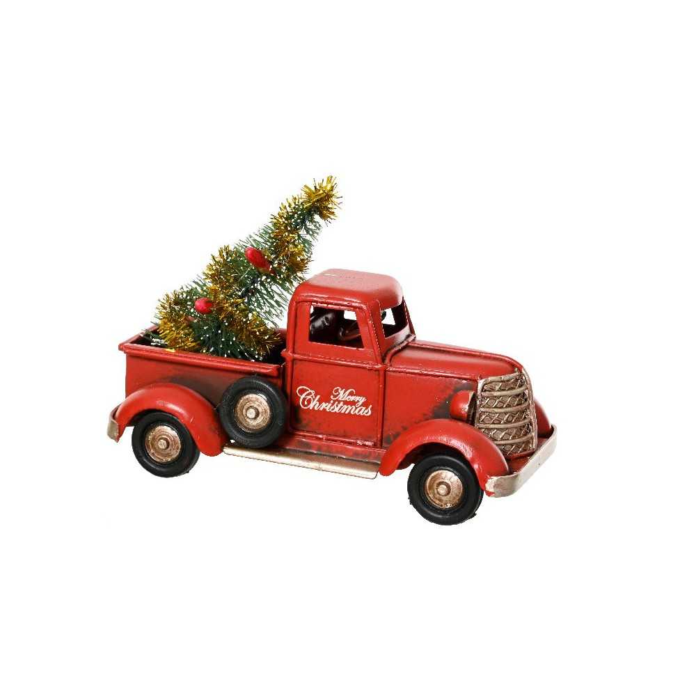 Retro rode vrachtwagen met een mini kerstboom en gouden versiering in de laadbak.