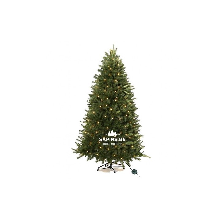 A lush green artificial Christmas tree adorned with warm white lights.