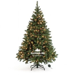 Arbre de Noël artificiel vert, décoré de lumières brillantes, posé sur un support noir.