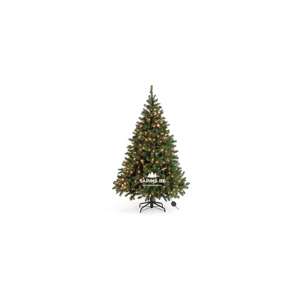 A lush green artificial Christmas tree adorned with warm white lights.
