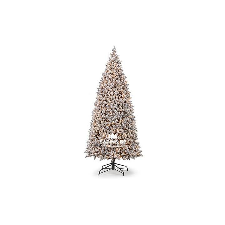 A tall, frosted Christmas tree with a snowy appearance and a sturdy black base.