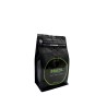 A sleek black coffee bag with a vibrant green label reading "Brazil." A sleek black coffee bag with a vibrant green label reading "Brazil."