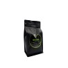Black coffee bag with a green label reading "BRAZIL" and a sleek, modern design. Black coffee bag with a green label reading "BRAZIL" and a sleek, modern design.