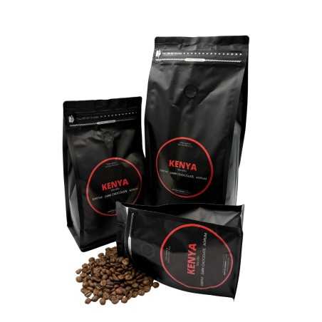 Three black coffee bags labeled "Kenya," with glossy surfaces and coffee beans scattered below. Three black coffee bags labeled "Kenya," with glossy surfaces and coffee beans scattered below.